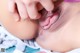 A close up of a woman's pussy with her hands on her hips.